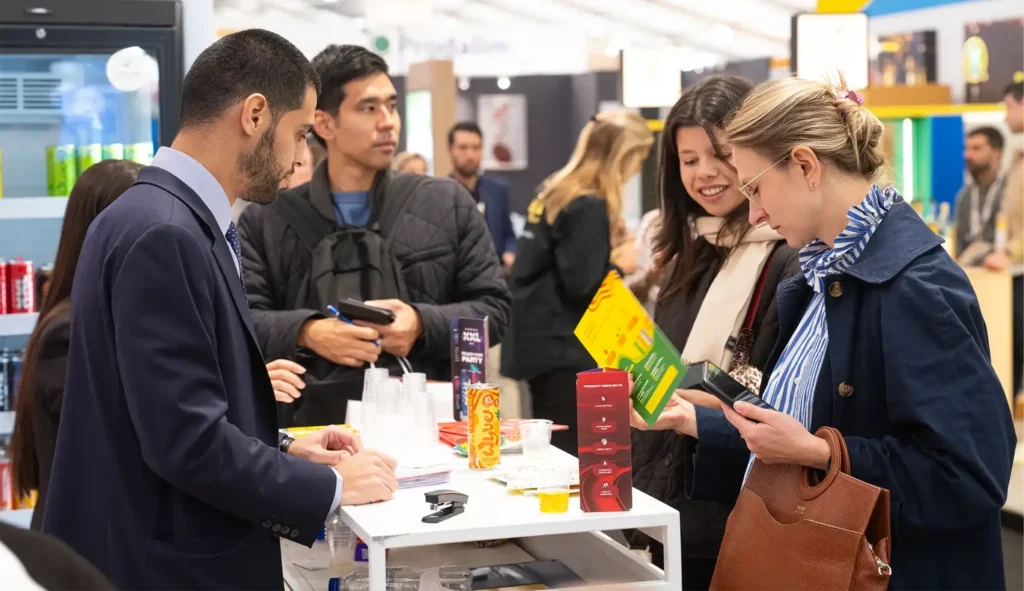 Visitors discovering WYVE protein soda and XXL at the IFFB stand at SIAL Paris 2026